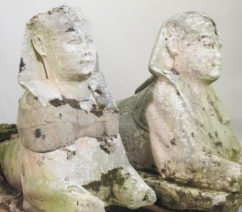 two ancient Egyptian stone sphinxes