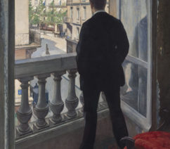 a man looking out a widow