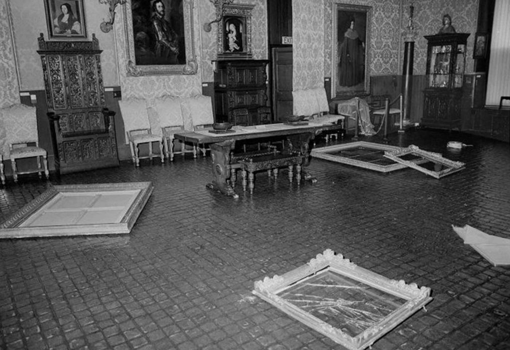 interior photograph of the Gardner Museum at the theft. Several empty frames on the floor.
