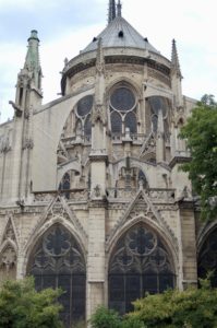 A view of the exterior of Notre Dame in Paris from the east side.