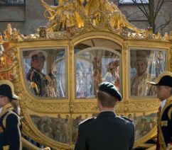 image of the Golden Coach with royalty inside - By Toni - originally posted to Flickr as the dutch royal family loves me!, CC BY 2.0, https://commons.wikimedia.org/w/index.php?curid=6512699