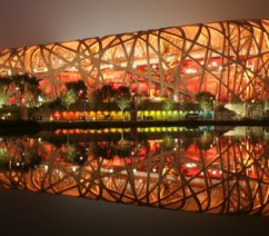 An evening image of the stadium with all its lights on