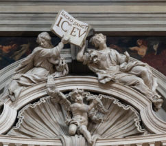 A Baroque arch with paintings of saints
