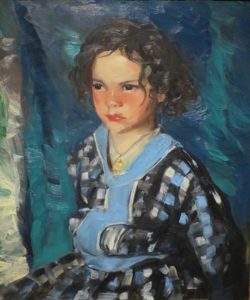 A young girl in a blue dress