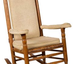 wood rocking chair with beige seat and back cushions
