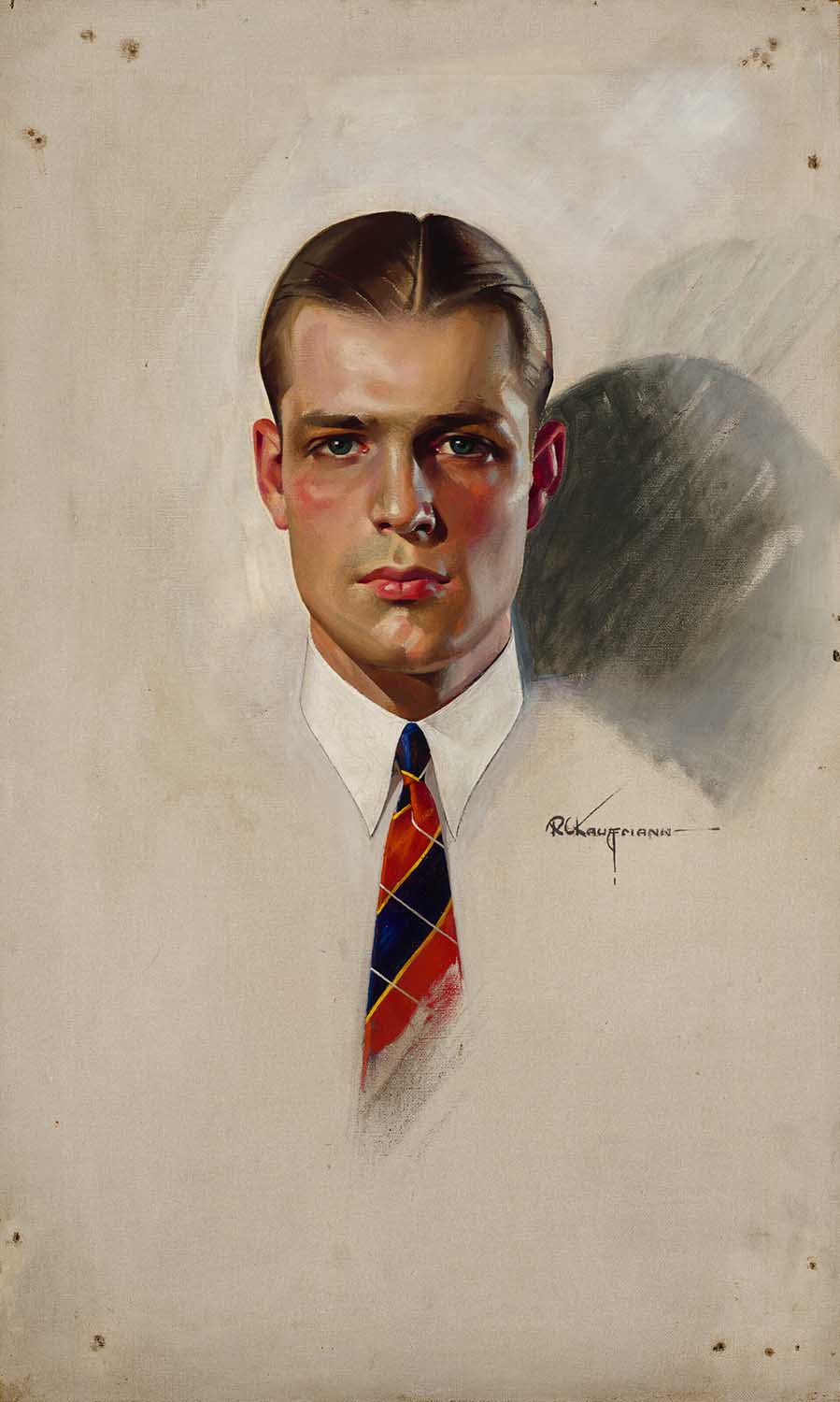 man wearing a white collared shirt and red and blue striped tie