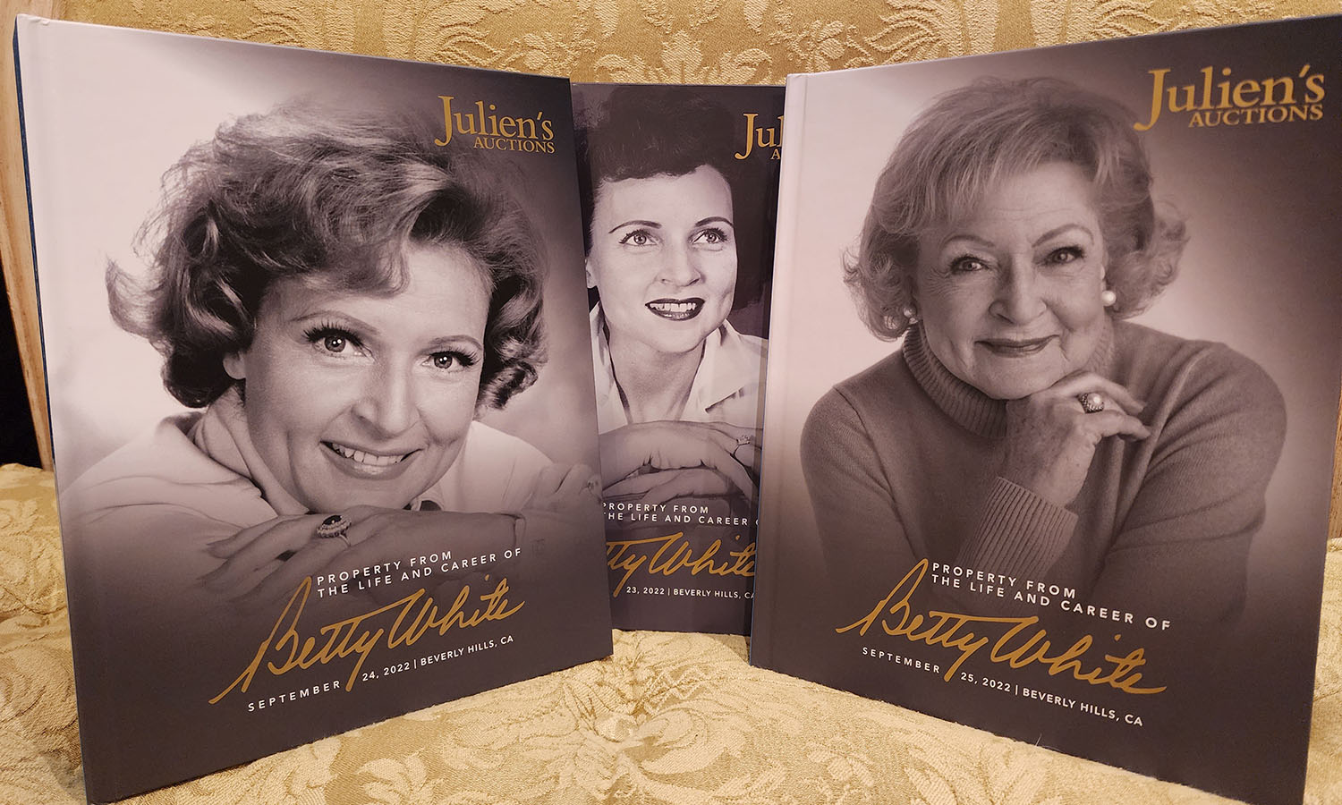 three catalogs with picture of betty white on each of them