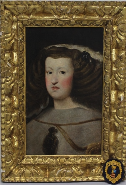 A bust-length portrait of a woman with a white mantle and a gold chain extending across her chest. She is expressionless, with very rosy cheeks and a wide, braided hairstyle decorated with pins and ribbons.