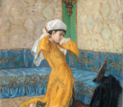 A painting offering an intimate look into a wealthy Ottoman woman's living space. She wears a yellow robe and kneels on a silk cushion as she puts on her head scarf.