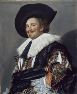 A seventeenth-century Frans Hals portrait of a Dutch man in fine clothing, a white ruff, and a broad-brimmed black hat. He enigmatically smiles at the viewer through his moustache.