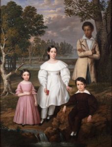 A 19th century American group portrait of three children with a mixed-race youth featured in the background.