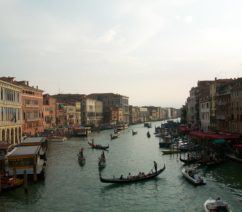 A view over the Grand Canal in Venice, with small boats and gondolas making their way to and fro
