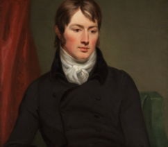 A portrait of the painter John Constable in a black suit with a white shirt sitting in a chair against red drapes