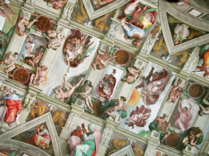 The ceiling of the Sistine Chapel, painted by Michelangelo Buonarroti showing scenes from the Book of Genesis including the Creation of Adam