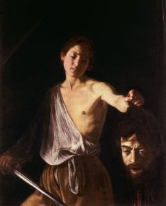 A painting of a boy representing the biblical David holding the head of the giant Goliath by his hair.