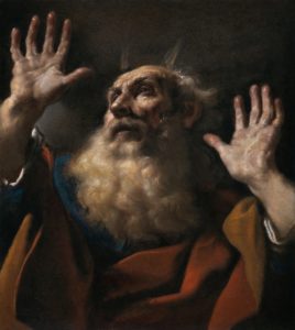 A portrait of an old, bearded man looking to the sky with his hands raised.