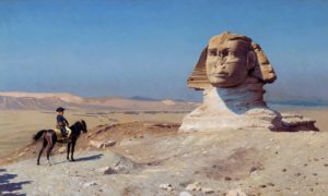 A painting showing a man on horseback in a bicorne hat, meant to be Napoleon Bonaparte, standing before the half-buried Sphinx statue at Giza.