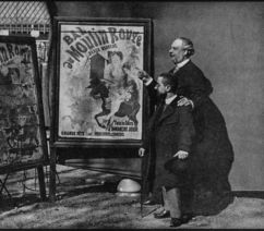 Henri de Toulouse-Lautrec standing with poster designer Jules Chéret with one of his posters for the Moulin Rouge.