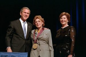 The artist Helen Frankenthaler receiving the National Medal of Arts, standing with President George W. Bush and First Lady Laura Bush.