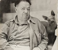 A photograph of Diego Rivera and his xolo dog