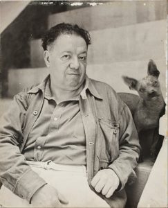 A photograph of Diego Rivera and his xolo dog