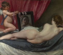 A painting of Venus laying nude with her back to the viewer while Cupid holds up a mirror.