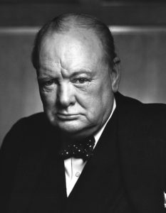 A black-and-white photographic portrait of British Prime Minister Winston Churchill