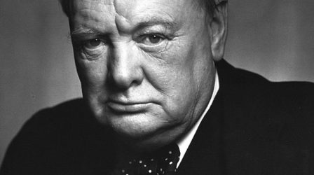 A black-and-white photographic portrait of British Prime Minister Winston Churchill