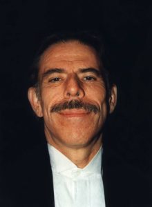 A photograph of the artist Peter Max