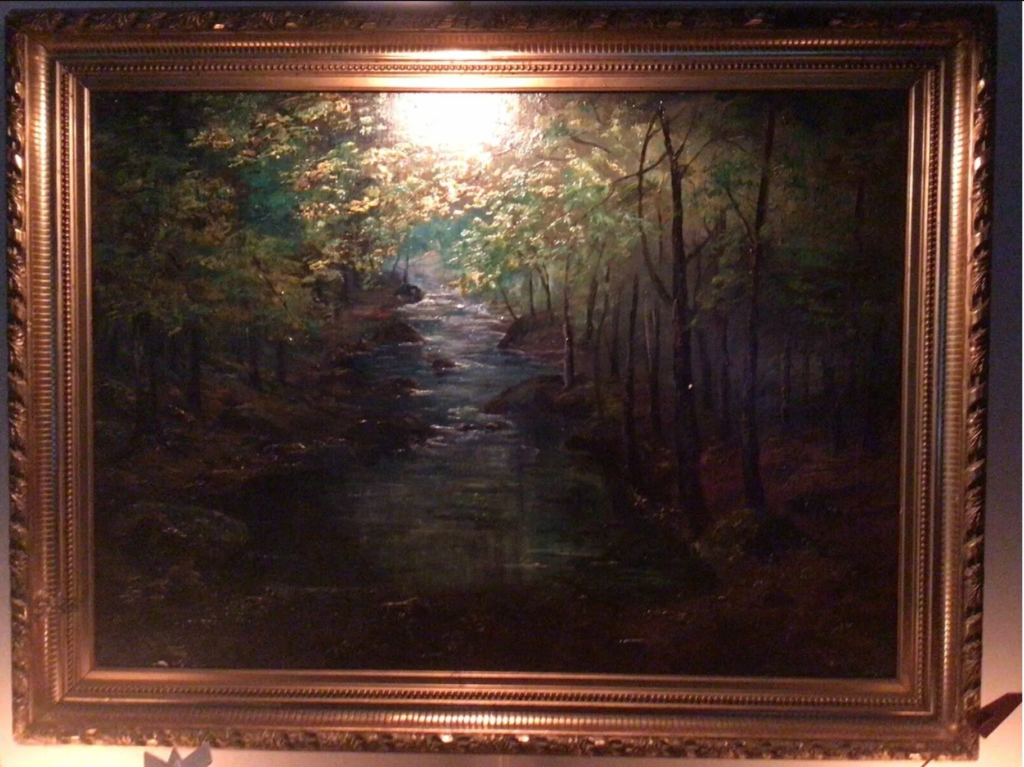 A photo of a landscape painting