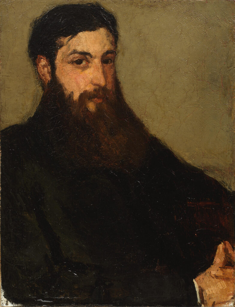 A portrait of a bearded man