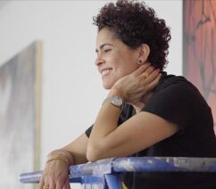 A photo of the artist Julie Mehretu in her studio.