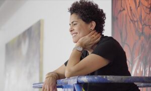 A photo of the artist Julie Mehretu in her studio.