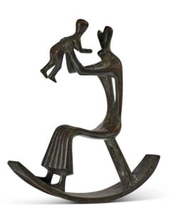 An abstract bronze sculpture of a person in a rocking chair holding up a child.