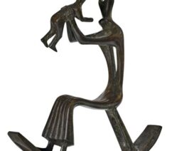 An abstract bronze sculpture of a person in a rocking chair holding up a child.