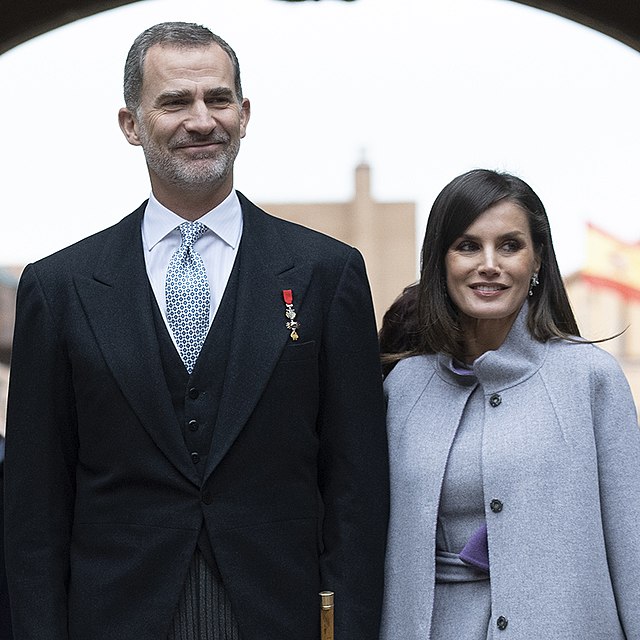 A picture of the king and queen of Spain in morning dress