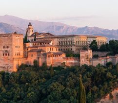 The Alhambra, a red stone hilltop fortress-palace in Spain.