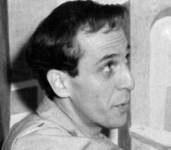 A black-and-white photograph of Philip Guston