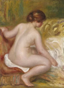 A painting of a nude woman from behind sitting on an armchair.