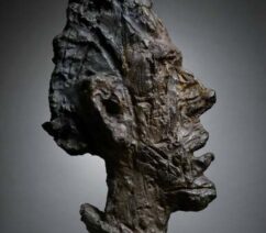 An abstract bronze bust of a man