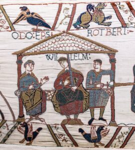 A segment of the Bayeux Tapestry, showing William the Conqueror in the center alongside his half-brothers Odo and Robert