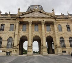 The facade of a large French chateau.