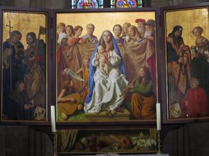 A religious triptych painting with a Madonna & Child in the center