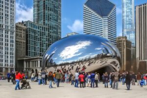 A large stainless steel sculpture in a public plaza.