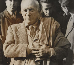 A black-and-white photograph of Pablo Picasso.