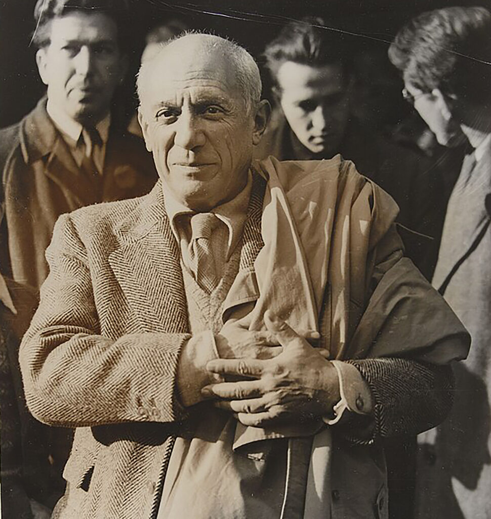 A black-and-white photograph of Pablo Picasso.