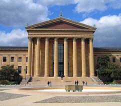 A large building with a classical-style columned portico