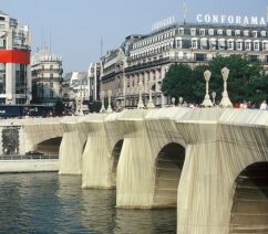 A photo of the Pont Neuf in Paris wrapped in tarps.