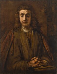 A 17th century half-length portrait of a young man with long hair and hands folded on top of a book.