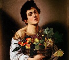 A Baroque painting of a young man holding a basket of fruit.